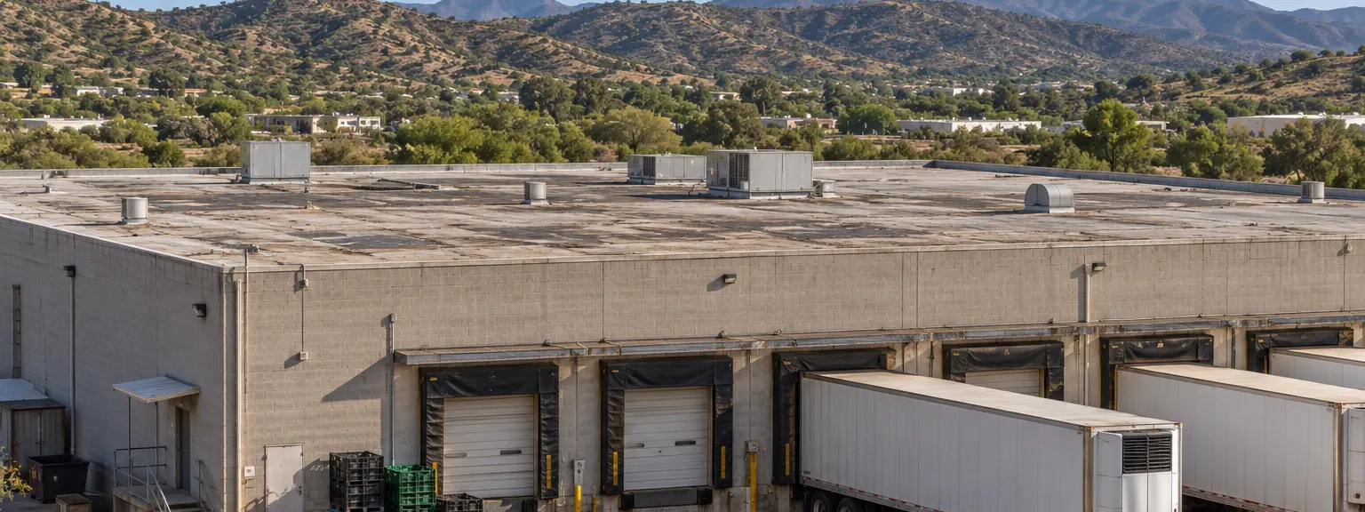 Cold storage warehouse with dock doors and refrigerated trailers in Rio Rico, AZ